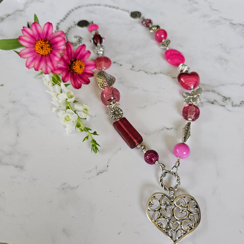 Long bright pink beaded necklace