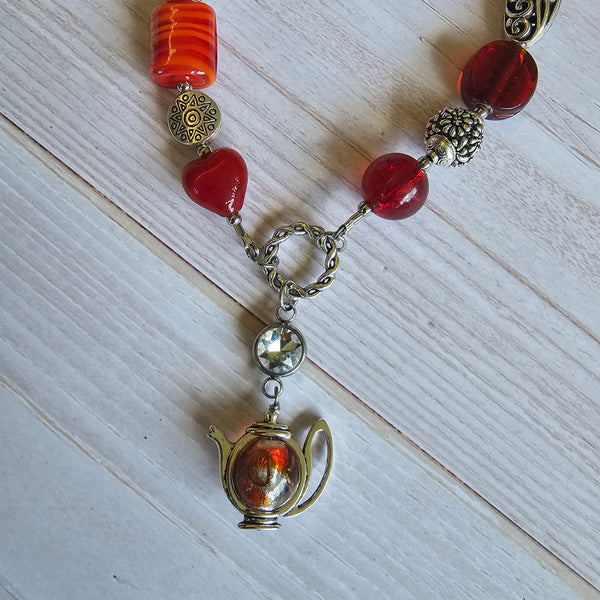 Long red beaded necklace