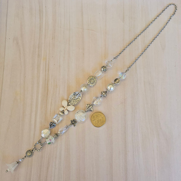 Long white beaded necklace