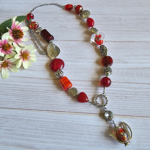 Long red beaded necklace