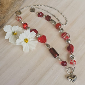 Long red beaded necklace