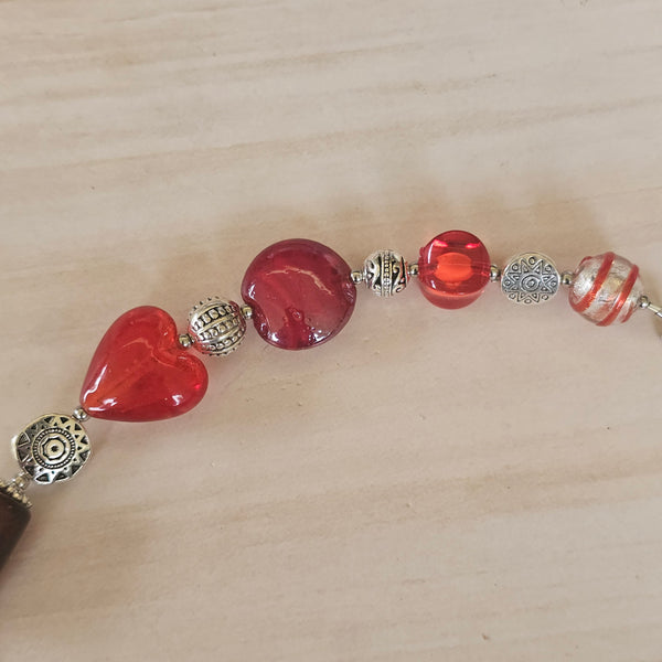 Long red beaded necklace